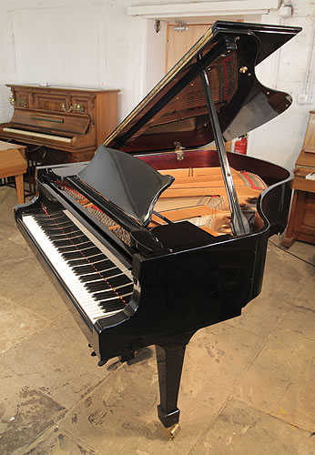 A Toyama TC-162 grand piano for sale with a black case and polyester finish