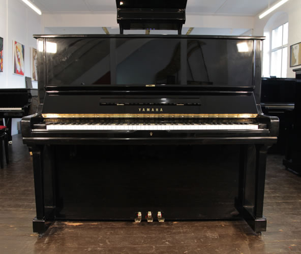 A 1972, Yamaha U3 upright piano with a black case and polyester finish