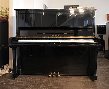 A 1991, Yamaha U30A upright piano with a black case and polyester finish. Piano features a fitted Disklavier MX100 player system