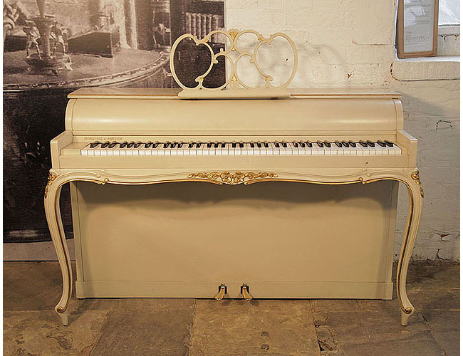 A 1968, Hornung and Moller upright piano with a Louis XV style case with gilt ornament and cabriole legs