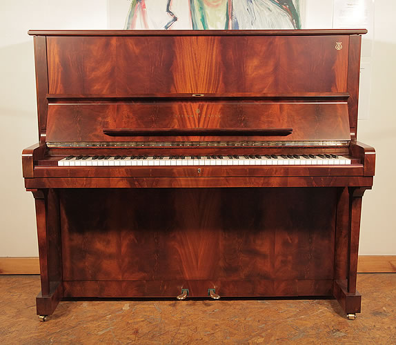 Piano for sale. A 1997, Crown Jewels, Steinway Model K upright piano with a flame mahogany case.