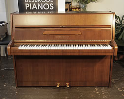 A 1982, Bechstein upright piano with a satin, mahogany case