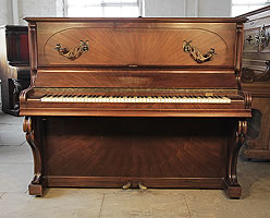 A 1924, Gaveau upright piano with a sunburst, rosewood case and Art Nouveau styling. Piano has an eighty-eight note keyboard and two pedals
