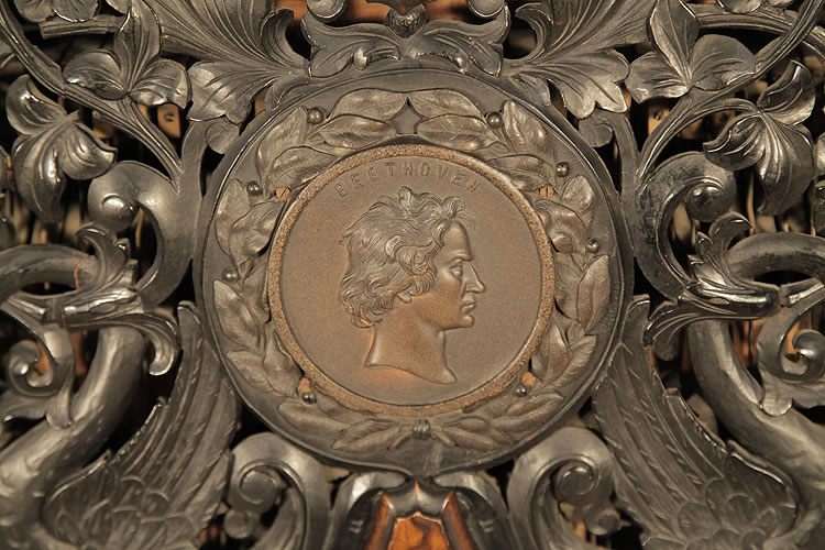 Steingraeber central plaque of Beethovens head with surrounding laurel wreath