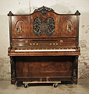 Piano for sale. An 1866, Steingraeber upright piano with a burr walnut case. Cabinet features an ornately, carved filgree panel with a central plaque of Beethoven