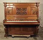 Piano for sale. An 1897, Steingraeber upright piano with a walnut case, carved filgree panel and ornate brass candlesticks