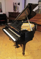 A restored, 1938, Steinway Model S baby grand piano with a black case and spade legs