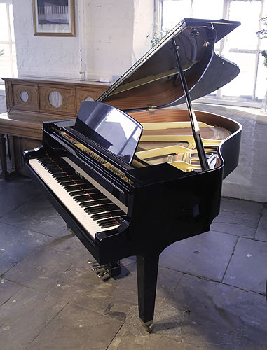 Yamaha GH1 baby grand piano for sale with a black case and polyester finish.