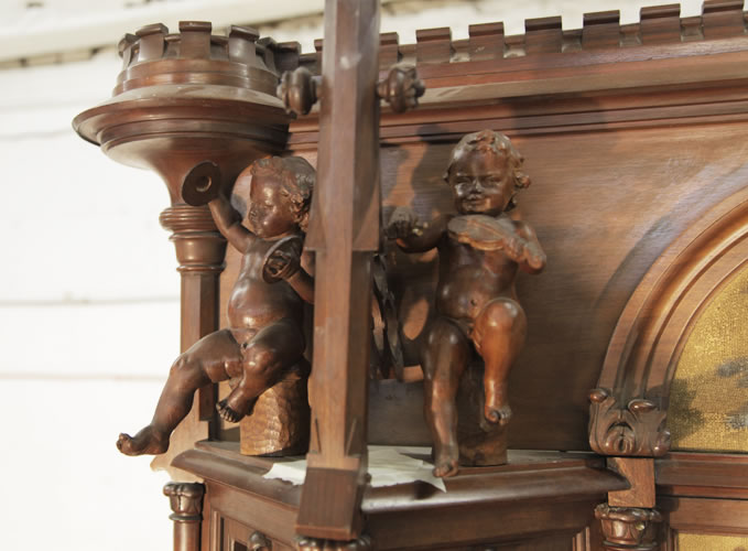 K.A. Andersson elaborate carvings of cherubs playing musical instruments