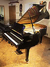 Piano for sale. A 2011, Fazioli F183 grand piano with a black case and spade legs