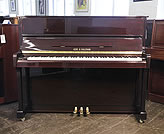 Piano for sale. A Gors Kallmann upright piano with a mahogany case