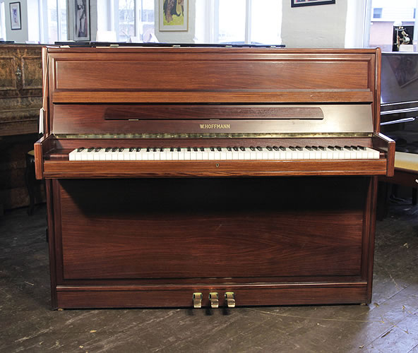 Hoffmann upright piano with a walnut case. Secondhand Specialist steinway piano dealer, trader and wholesaler. Besbrode Pianos Leeds Yorkshire England UK.