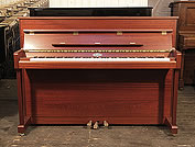 Piano for sale. A   Kemble upright piano with a polished, mahogany case