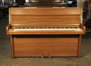 Piano for sale. A 1986, Samick upright piano with a polished, walnut case 