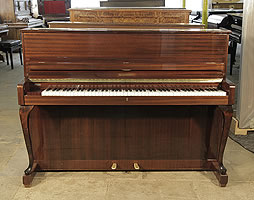 A 1961, Schimmel upright piano with a mahogany case and cabriole legs