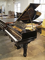 An 1898, Steinway Model A grand piano for sale with a black case, filigree music desk and fluted, barrel legs
