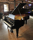 Piano for sale. A 1972, Steinway Model C grand piano with a satin, black case and spade legs