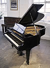 Piano for sale. A 1936, Steinway Model M grand piano with a black case and spade legs