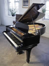Piano for sale. A restored, 1908, Steinway Model O grand piano with a black case and spade legs