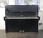 Piano for sale. A secondhand, Yamaha U2 upright piano with a black case and polyester finish. 