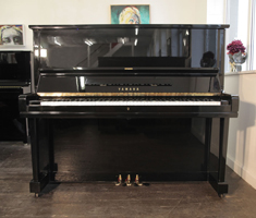 A 1965, Yamaha U3 upright piano with a black case and polyester finish