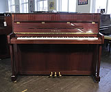 Piano for sale.  A Yamaha V114N upright piano with a mahogany case and polyester finish