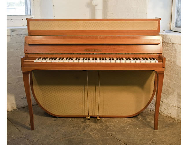 A 1955, Mid Century Modern style, Grotrian-Steinweg model 110 upright piano with a walnut case and fabric panels