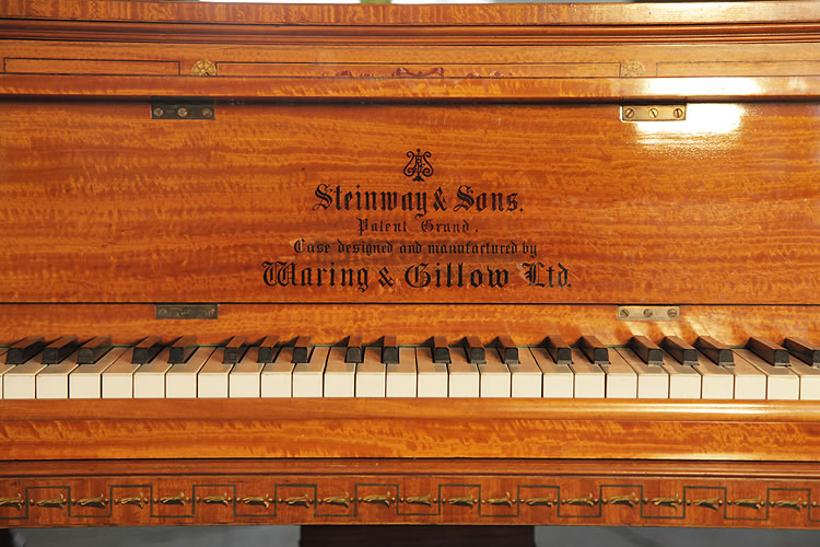Steinway piano manufacturers logo on fall. Case designed and manufactured by Waring & Gillow