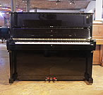 Piano for sale. A 1998, Steinway Model V upright piano with a black case and brass fittings