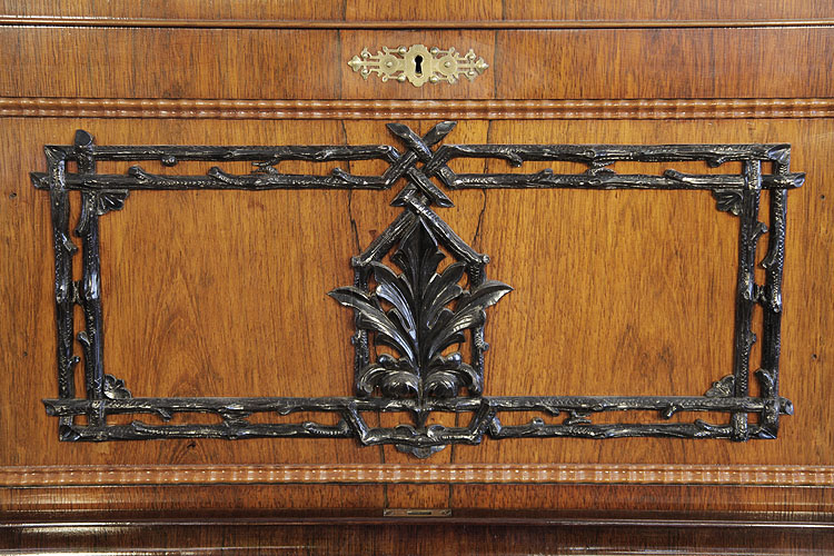 Holling Spangenberg front panel featuring intertwined branches and flowers and a central anthemion in contrasting wood