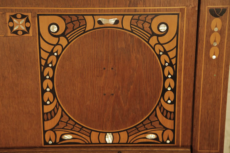 Kohl front panel detail featuring contrasting ebony and mother of pearl inlay in a stylised floral design