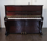 Piano for sale. A Samick upright piano with a mahogany case and cabriole legs. Piano has an eighty-eight note keyboard and three pedals.