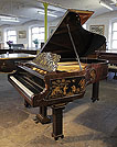 Piano for sale. An 1899, Chinese Chippendale style, Schiedmayer grand piano for sale with a flame mahogany case and Malborough legs with applied fret carvings. Cabinet features Chinese scenes in embossed Japanning with gilt ornament.