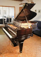 A 1909, Steinway Model A grand piano for sale with a rosewood case, geometric cut-out music desk and spade legs.