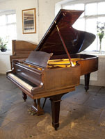 A 1923, Steinway Model B grand piano with a mahogany case and spade legs