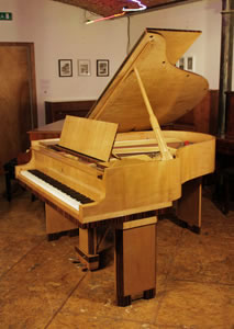 Art-Deco style, restored, 1932, Steinway Model M grand piano for sale with a crossbanded, maple and coromandel case. Cabinet features strong geometric styling.An 1886, Steinway & Sons Model D concert grand piano with a rosewood case, filigree music desk and turned, fluted legs