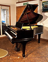 A rebuilt, 1911, Steinway Model O grand piano for sale with a black case and spade legs 