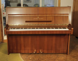 A 1970, Steinway Model Z upright piano with a mahogany case.