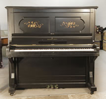 An 1886, Steinway upright piano with a satin, black case and floral inlaid panels. Piano has an eighty-eight note keyboard and three pedals