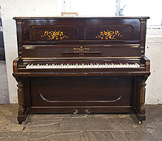 An 1896, Steinway upright piano with a rosewood case and floral inlaid panels.
