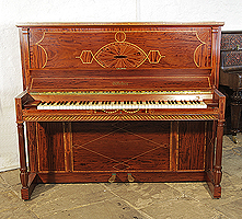 A 1912, Weber upright piano for sale with a flame mahogany case and turned, fluted legs. Cabinet inlaid with a stylised, Neoclassical design featuring geometric forms in a variety of woods