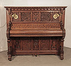 Piano for sale. Renaissance style, Gebruder Knake upright piano for sale with an ornately carved, oak case.
