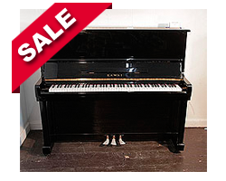 Reconditioned, Kawai KU-1B upright piano with a black case and polyester finish