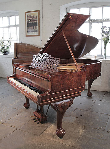 An 1896, Steinway Model B grand piano for sale with a burr walnut case, filigree music desk and Queen Anne style, cabriole legs