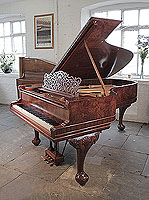 An 1896, Steinway Model B grand piano for sale with a burr walnut case, filigree music desk and Queen Anne style, cabriole legs. Piano has a three-pedal lyre and an eighty-five note keyboard.