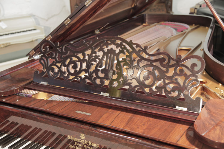 Steinway Centennial  grand  music desk in an openwork filigree design of arabesques and a central lyre motif