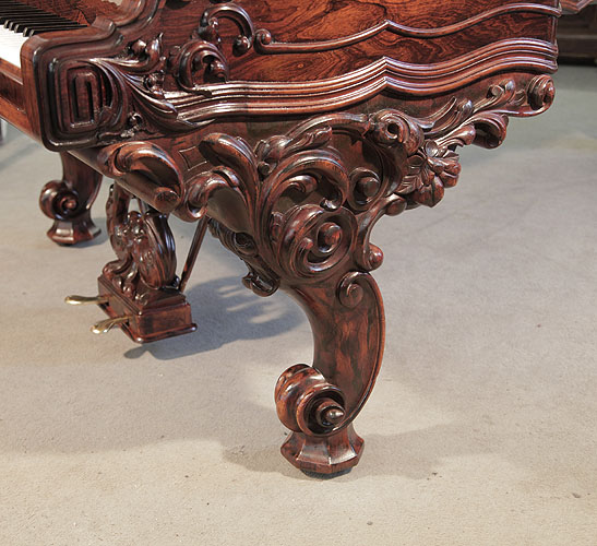 Steinway Centennial reverse scroll piano leg carved with foliage in high relief.