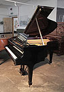 Piano for sale. A 1936, Steinway Model M grand piano for sale with a black case and spade legs. Piano has an eighty-eight note keyboard and a two-pedal lyre.