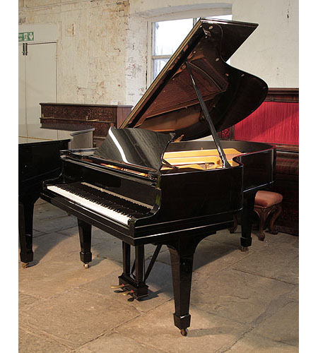 A 1926, Steinway Model O grand piano with a black case and spade legs. Piano has an eighty-eight note keyboard and a two-pedal lyre. 
