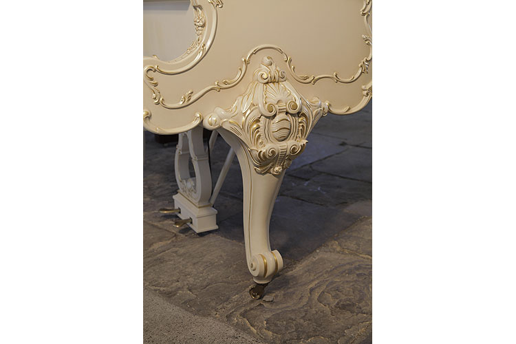 Steinway model O cabriole piano leg ornately, carved with anthemions, cabuchons and scrolling foliage with gilt accents